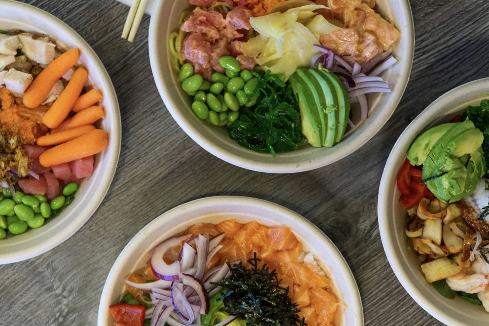 Mixed poke bowls with seafood, chicken and fresh produce at Poke King, a Hawaiian Restaurant in Spokane