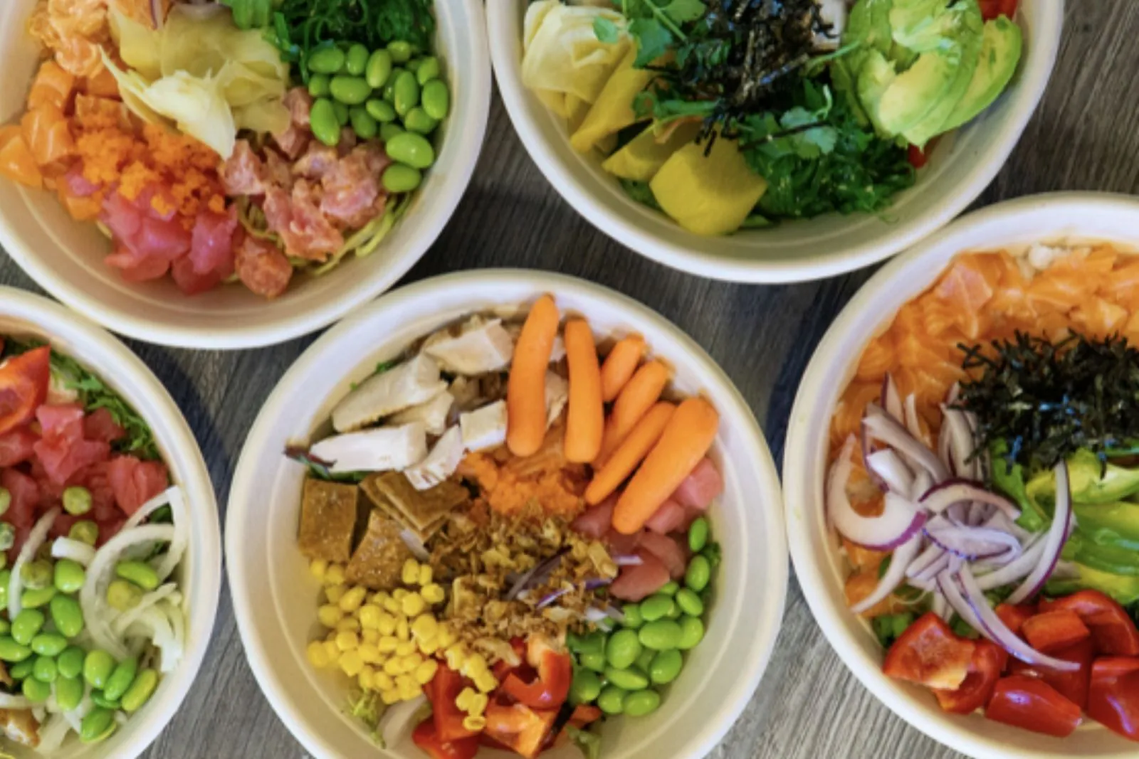 Assorted poke bowls with seafood, veggies and toppings at Poke King, a Hawaiian Restaurant in Spokane